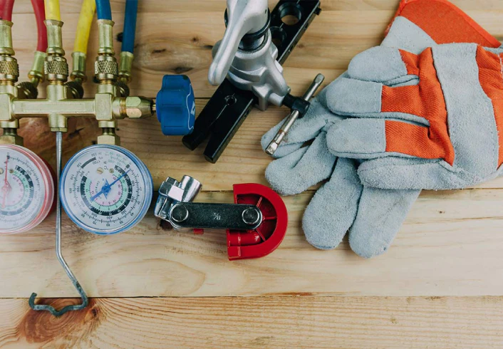 ac installation hvac gauge gloves and other tools on wood table tucson az